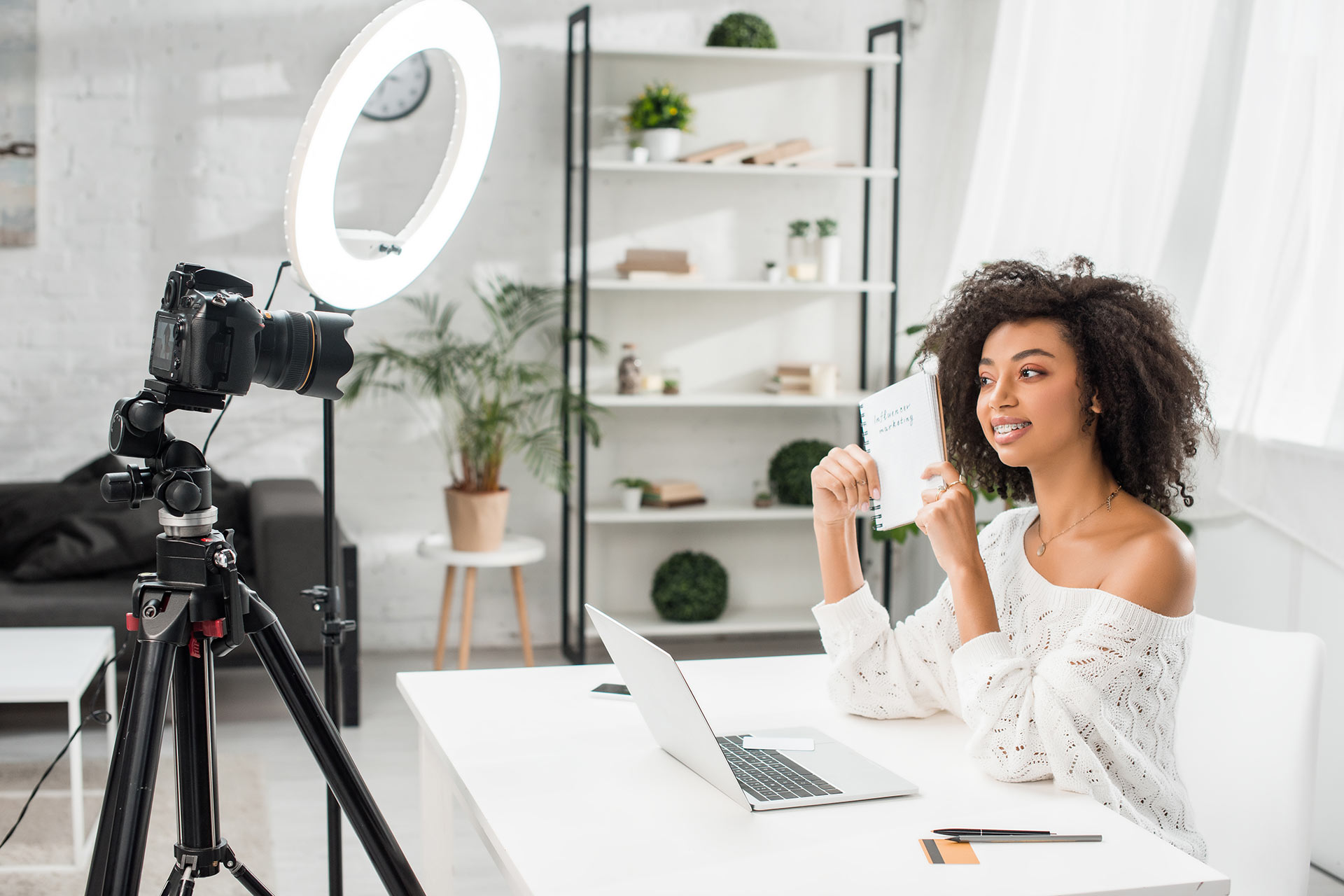 happy-african-american-video-blogger-in-braces-hol-2021-08-30-19-47-23-utc